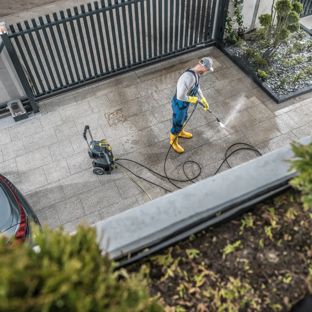 Clean concrete driveway and walkway restored before weekend guests arrive at suburban home